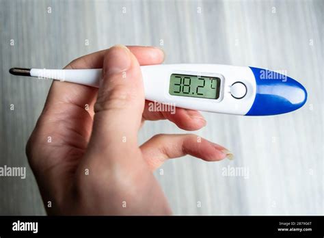 Thermometer reading a fever temperature during the 2020 Coronavirus ...