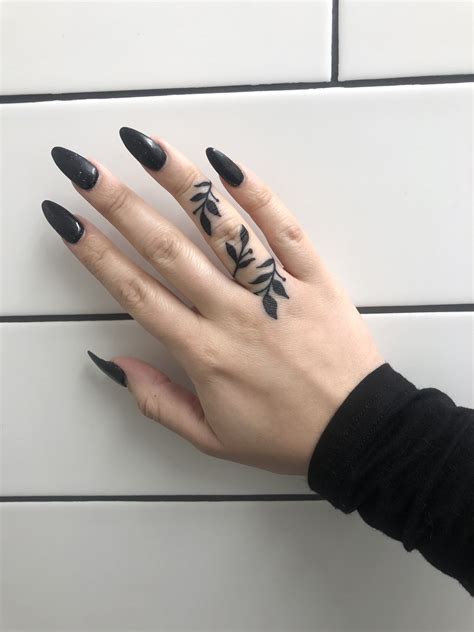 floral finger tattoo | Pretty hand tattoos, Hand and finger tattoos ...