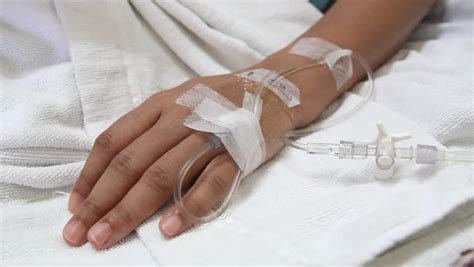 Closeup Saline Drip Into Patient Hand On Bed In Hospital Stock Footage ...