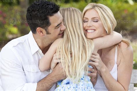 Girl Child Hugging Happy Parents In Park or Garden 854548 Stock Photo ...