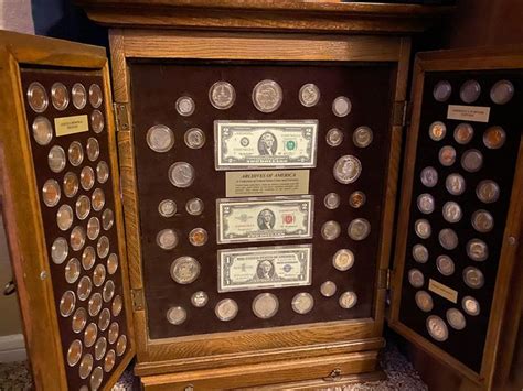 Collectible coin in cabinet what’s a very nice wooden display case ...