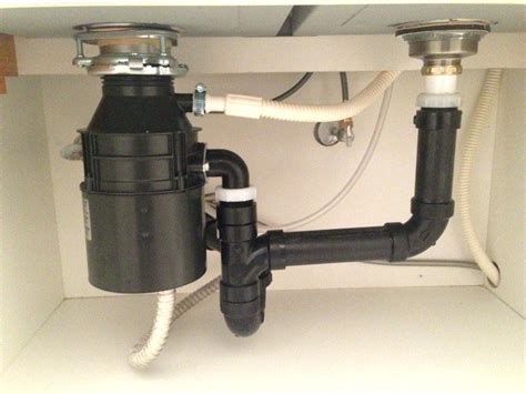 Garbage Disposal Water Comes Back Up: Why & How To Fix It