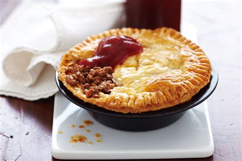 a pie sitting on top of a white plate