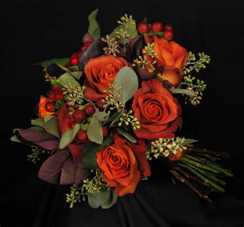 Burnt orange roses with mango calla lilies, burgundy berries, seeded ...