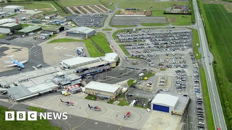 Humberside Airport staff back strike action over pay dispute - BBC News