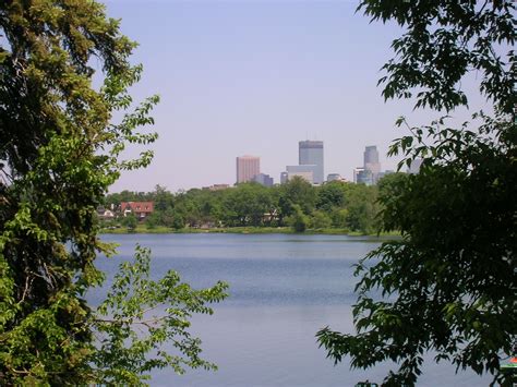 the city is in the distance from the water's edge, as seen through some ...