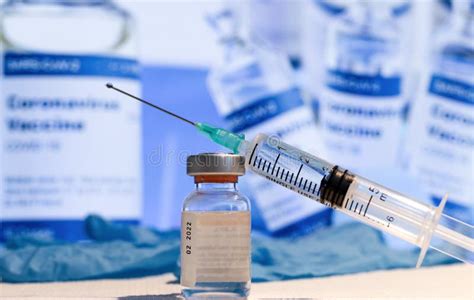 A Bottle with Vaccine and Syringe with Needle. Stock Photo - Image of ...