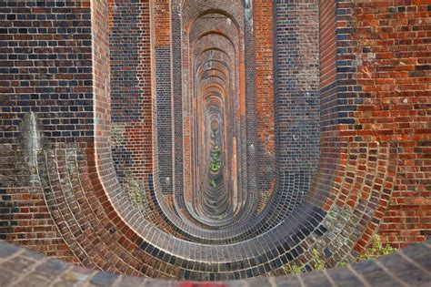 an aerial view of the inside of a brick building, looking down at it's ...