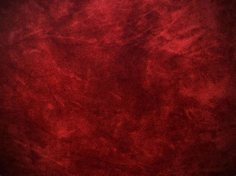 Dark red velvet fabric texture used as background. Empty dark red ...