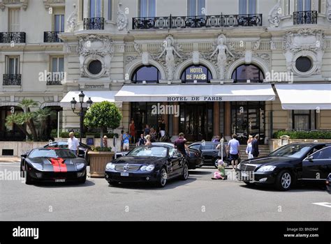 3 luxury cars and people outside Hotel de Paris in Monaco Monte Carlo ...