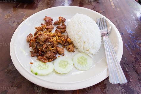 Fried pork with garlic and pepper and rice 6076082 Stock Photo at Vecteezy