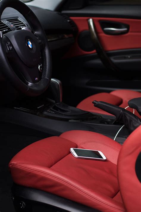 the interior of a car with red leather and black stitching on the ...