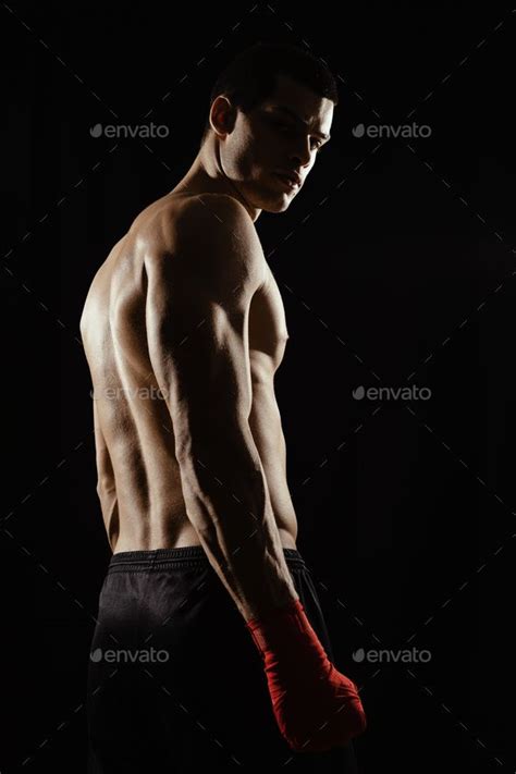 Portrait of male boxer looking over shoulder | Looking over shoulder ...