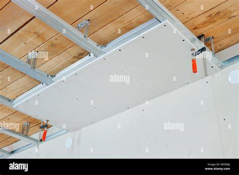 Installation of false ceiling of gypsum board Stock Photo - Alamy