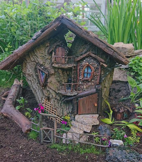 I just finished another log fairy house. I just need a few more little ...