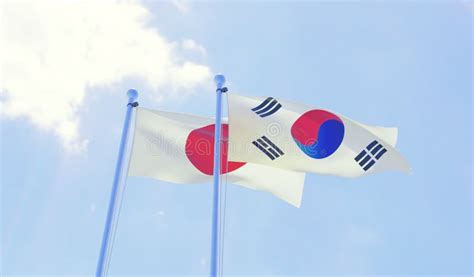 Japan and Republic of Korea, Flags Waving Against Blue Sky Stock ...