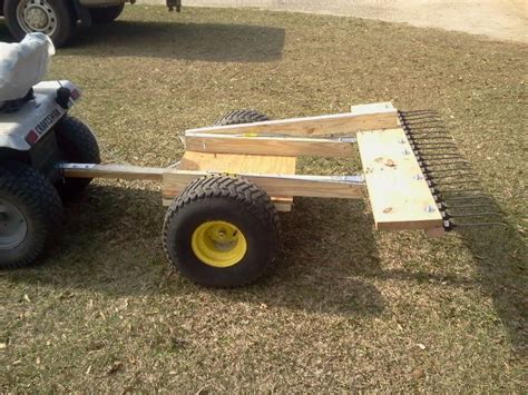 Pinestraw rake in dump position | Homemade tractor, Tractor idea, Diy lawn