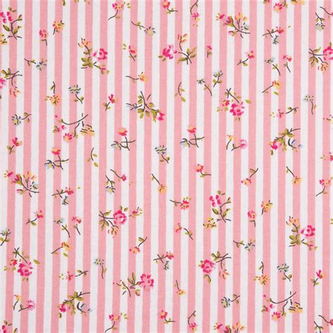 a pink and white striped wallpaper with flowers on the bottom, stripes ...