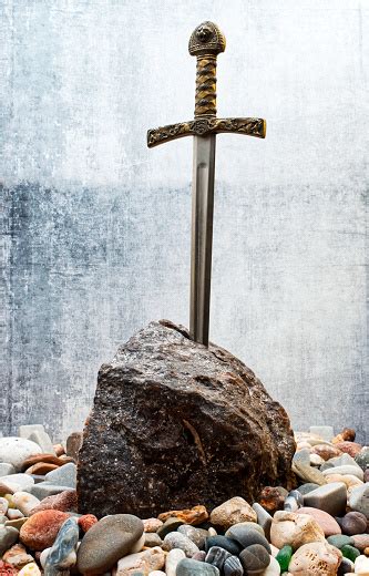 Excalibur The Mythical Sword In The Stone Of King Arthur Stock Photo ...