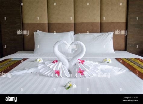 Swan towel decoration on bed in bedroom interior Stock Photo - Alamy