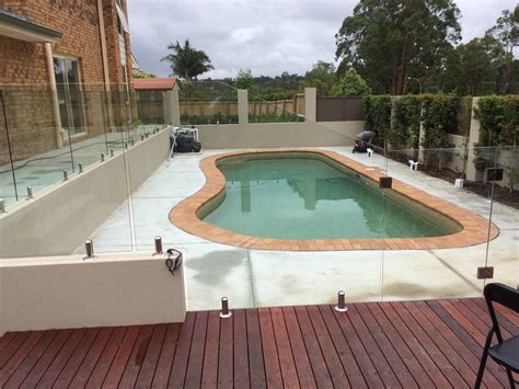 This Frameless Glass pool fence was installed on top of a deck in ...