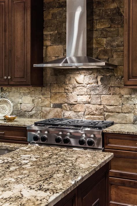 Stacked Stone Backsplash and Stainless Steel Range Hood | Rustic ...