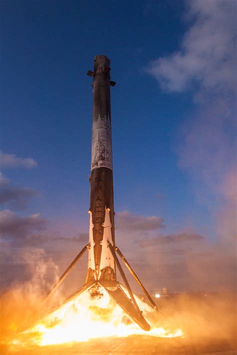 Stunning new SpaceX photos show a twice-used rocket landing on a ship ...