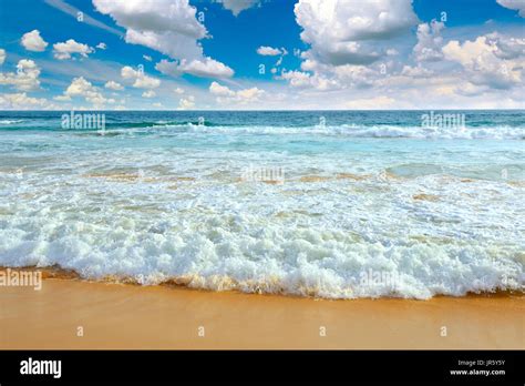 Ocean waves and blue sky Stock Photo - Alamy