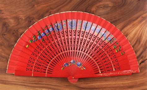 Premium Photo | Paper chinese fan on wooden background