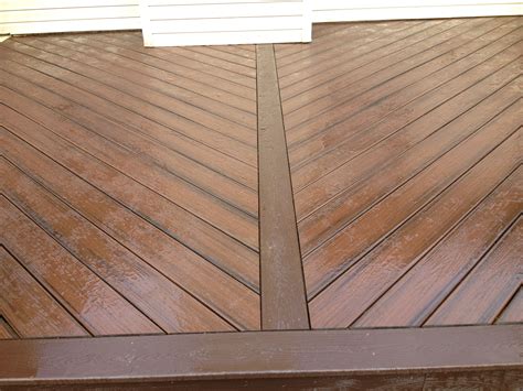 Lava rock herringbone pattern deck with vintage lantern picture framing ...