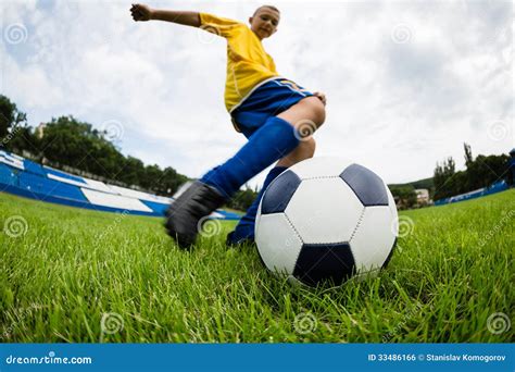 Boy Soccer Player Hits the Ball Stock Photo - Image of kick, leisure ...