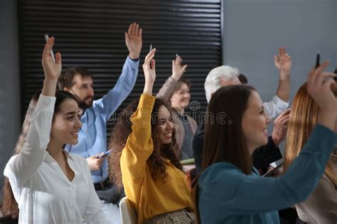 People Raising Hands To Ask Questions at Business Training Stock Image ...