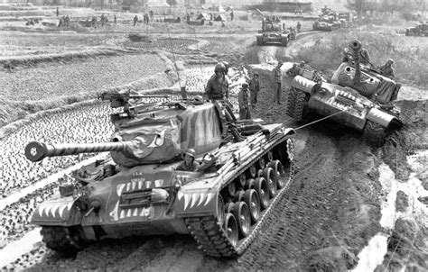 An M46 Patton assists another M46 that got stuck in the mud in Korea ...