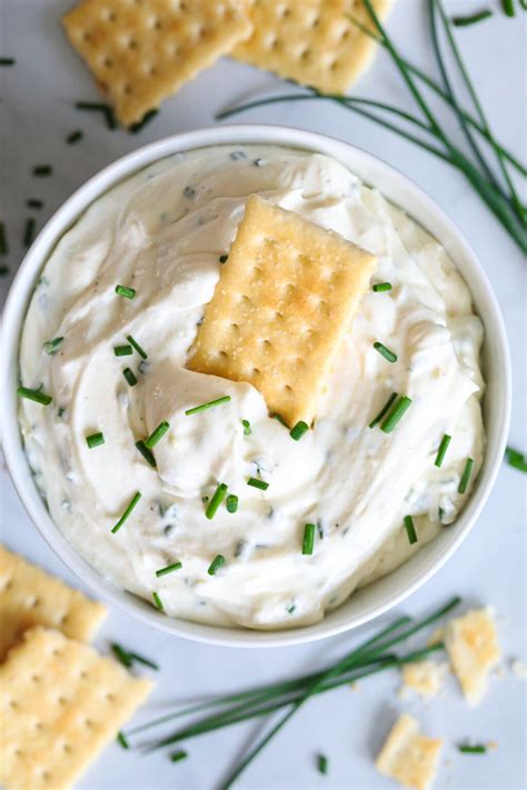 Aerial view of Garlic Cream Cheese Dip with a cracker in it and more on ...