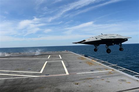 Autonomous X-47B drone successfully lands on Navy aircraft carrier for ...