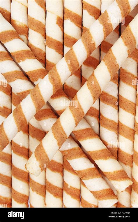 Ice cream wafer sticks as background. Wafer biscuit swirled stick ...