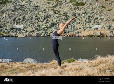 yoga poses woman mountain Stock Photo - Alamy