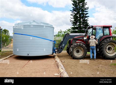 INSTALLING A WATER TANK Stock Photo - Alamy