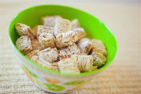 Bowl Of Frosted Wheat Cereal Stock Photo - Download Image Now - iStock