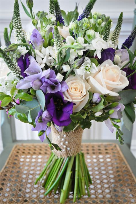 Lilac and purple freesias with white bouvardia and cream roses for a ...