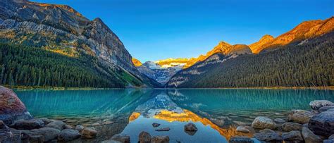 A Panoramic View of Sunrise at Lake Louise, Banff National Park, Canada ...