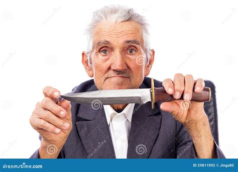 Portrait Of An Old Man Holding A Knife And Looking At Camera Stock ...