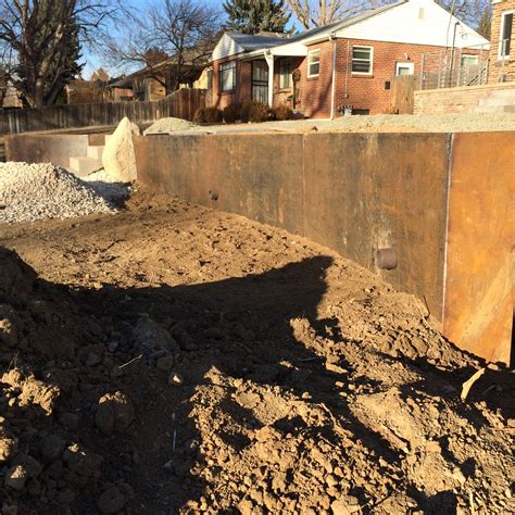 Corten steel retaining wall almost set. Installed by Industrial Luxury ...