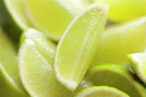 Lime wedges (close-up) - Stock Photo - Dissolve