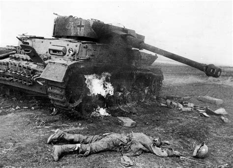 Destroyed German tank Pz.Kpfw. IV and killed soldier of the Wehrmacht ...