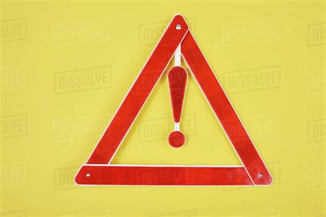 top view of warning triangle road sign isolated on yellow - Stock Photo ...