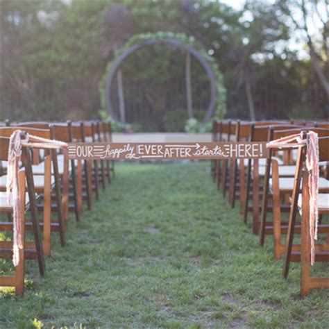 Learn how to DIY this wedding ceremony aisle tie-off sign!