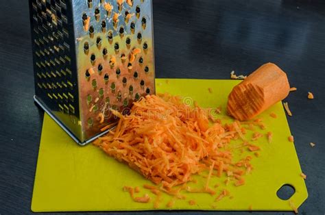 Grated Carrots and Steel Grater Stock Image - Image of juicy, hand ...