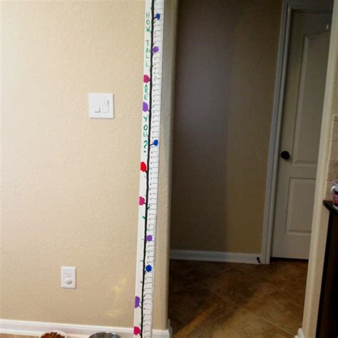 DIY height chart! 7ft 2x4 painted white, then take a ruler and copy it ...