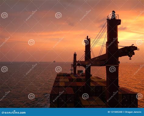 Container Ship at the Sunset, Orange Sky Editorial Stock Photo - Image ...